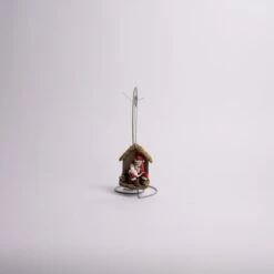 Kneeling Santa With Baby Jesus Ornament