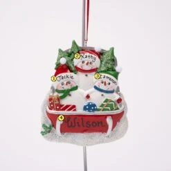 Snowman On Sled Family Of Three